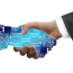 AI-human collaboration - human and AI shaking hands